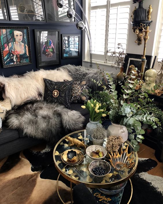 a shiny boho living room with faux fur throws and embellished and embroidered pillows