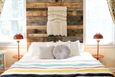 13 a reclaimed wood headboard coming up to the ceiling is accented with a macrame hanging and antlers for a boho feel