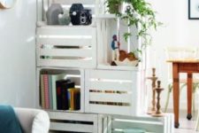 13 a white crate shelving unit doubles as a space divider, it’s a functional idea for any open layout