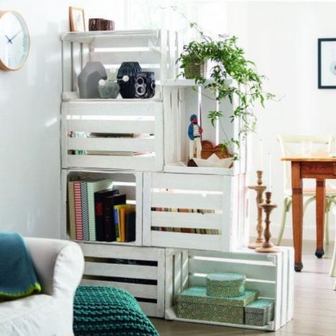 a white crate shelving unit doubles as a space divider, it's a functional idea for any open layout