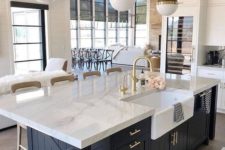 14 a chic farmhouse kitchen with elegant pendant two tone lamps on chains that highlight the mood and style