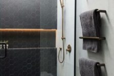 14 matte black hex tiles accented with neutrla grout and paired with large scale neutral tiles