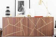 15 a Stockholm sideboard with gold hairpin legs and a geometric design made with gold foil tape