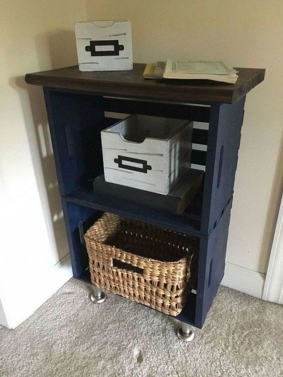 a small entryway console of navy crates, a dark stained tabletop and metal legs is a very cool idea for a small space