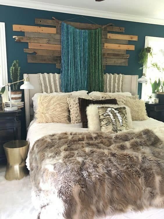 faux fur thrwos and blankets cozy up the bedroom for the fall and coming winter