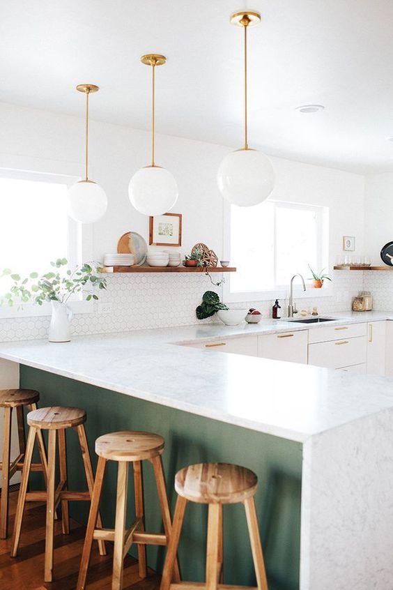 white glass bubble pendant lamps continie the decor style of the kitchen giving it a light feeling