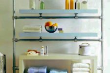16 Ikea Lack shelves and galvanized pipes and fittings turned into a stylish and chic shelving unit for a large bathroom