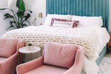 16 a beautiful blue upholstered headboard is soft and chic, and light pink chairs continue the pastel tone of the space