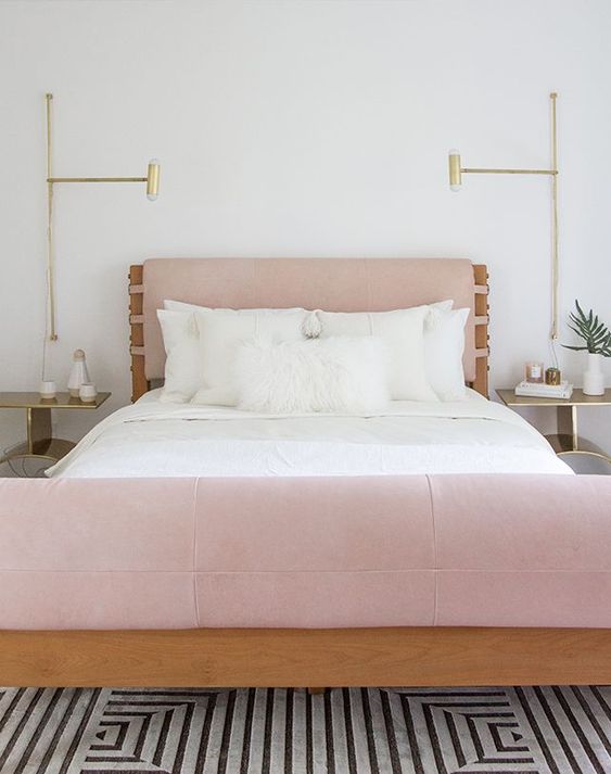 a pink leather upholstered headboard and foot of the bed make up a unique look
