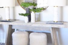16 two little stools covered with white faux fur will add a chic and cozy touch to the space