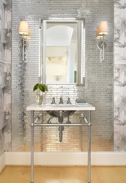 Small scale reflective tiles that reflect the lamp light and look very shiny and statement like