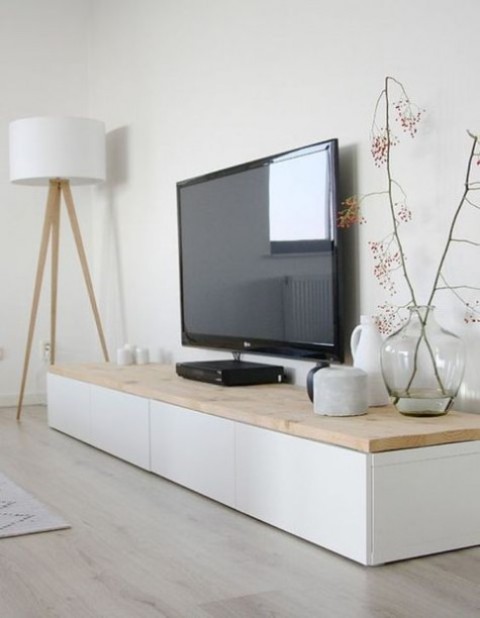 a TV unit of IKEA Besta and a light stained wooden countertop is a perfect fit for a Scandinavian room