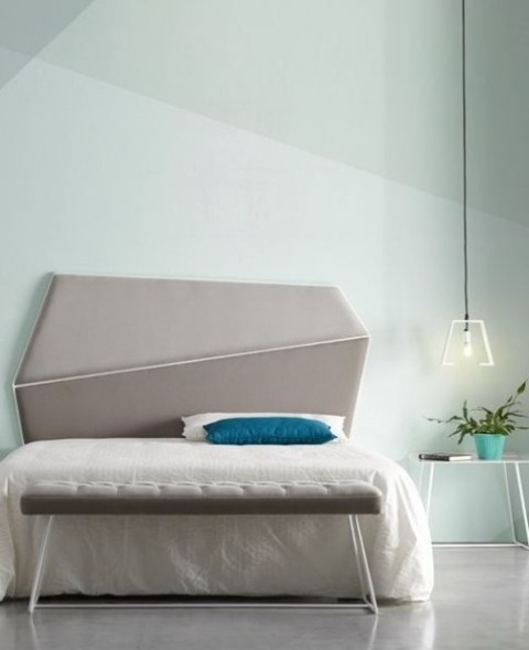 a modern asymmetrical geometric upholstered headboard in two shades of grey leather si a chic accent in the bedroom