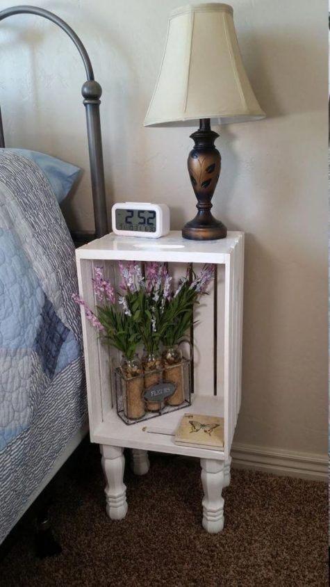 a nightstand made of a white crate and vintage legs will easily fit a refined space with a vintage feel