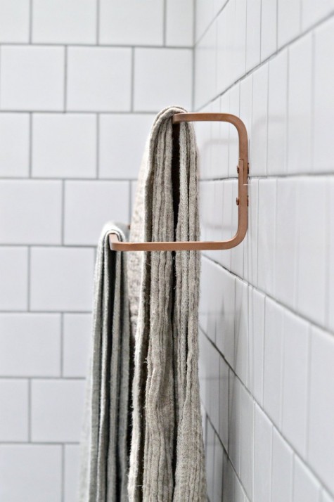an Ikea Hjalmaren towel rail spray painted copper for a more chic look will fit a contemporayr bathroom