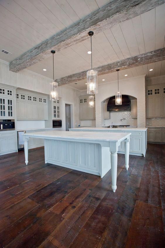 ceiling lights and original pendant lamps modernize the farmhouse kitchen done in white