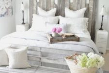 22 a shabby chic greyish headboard made of planks of different height for a nonchalant feel in the space