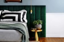 23 an emerald velvet padded headboard and brass accents that make the color stand out even more