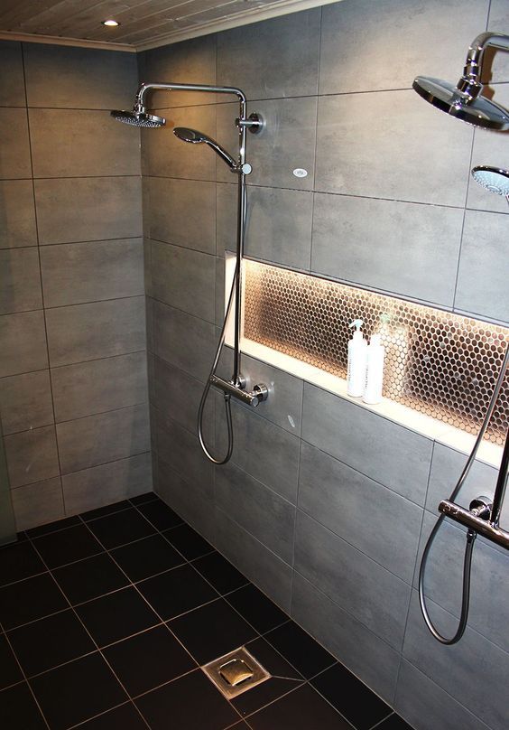 some built-in shower lights on the ceiling and a lit up niche for a cozy feel in the shower