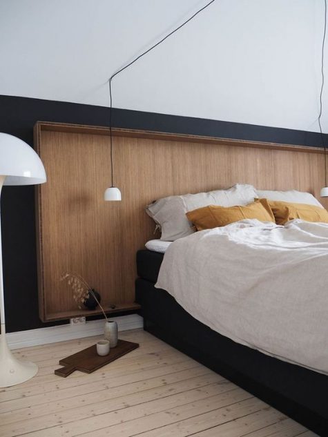 a sleek wooden headboard with a frame matches this Scandinavian bedroom and looks pretty and chic