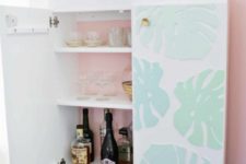 24 an IKEA Ivar cabinet turned into a stylish kid-proof home bar with a 3D tropical leaf print