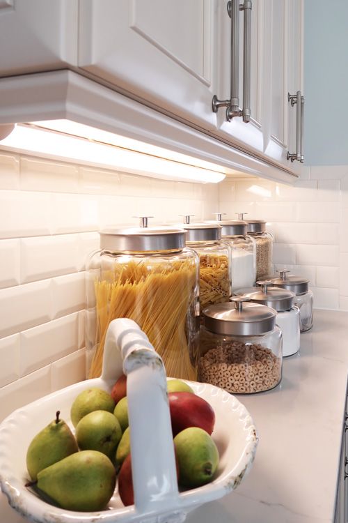 install some lamps or LED lights under the cabinets to make all the countertops lit up