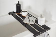 25 an Ikea Hejne bookcase shelf transformed into a stylish bathtub tray and stained dark