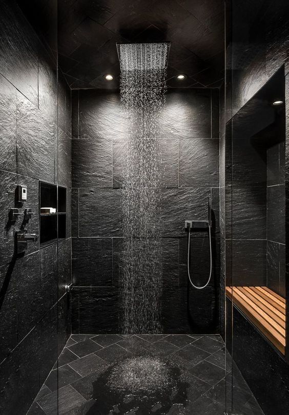 lights in the ceiling illuminate the shower space gently keeping it moody and rather relaxing