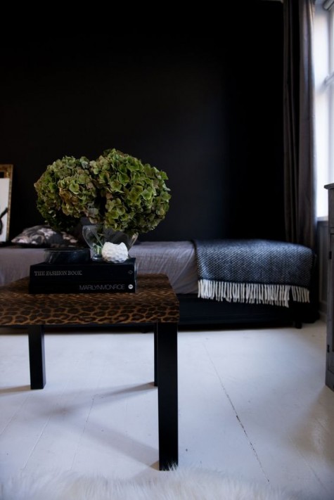 an elegant IKEA Lack coffee table done with animal print contact paper - such prints are on top