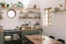 a small porthole window sprucing up a boho and mid-century modern kitchen and making it catchier