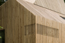 02 The house is fully clad with wood to highlight its lines and shapes and to contrast  the original home