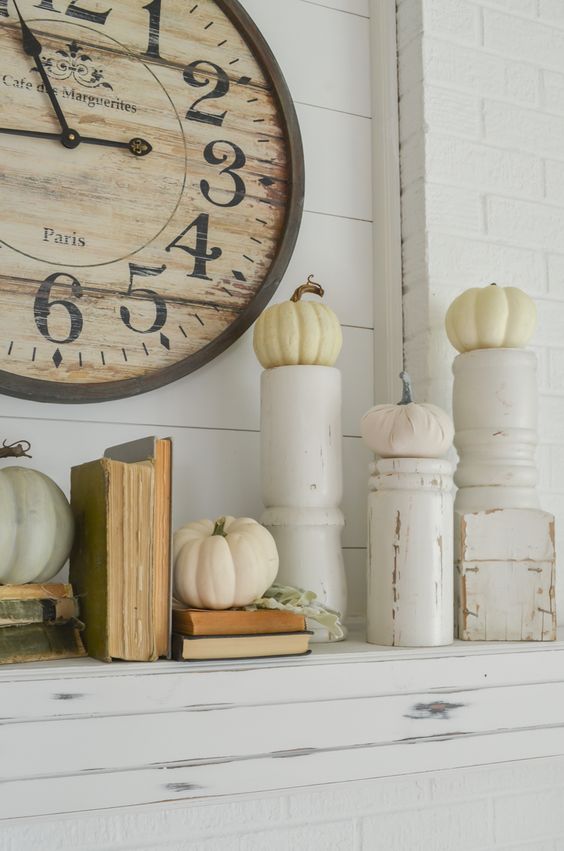 take rustic candleholders and use them pumpkins stands for the fall, it's a very creative idea