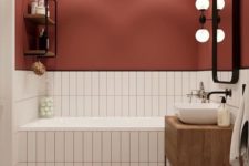 06 a burgundy wall paired with neutral tiles with matching grout is a cool fall-like idea