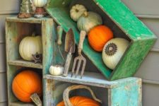 06 use old shabby chic crates to create a bold pumpkin display on your porch