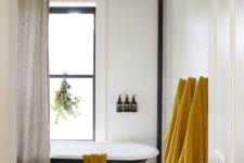 09 a set of mustard towels is a budget-friendly and easy way to bring a fall feel to your bathroom