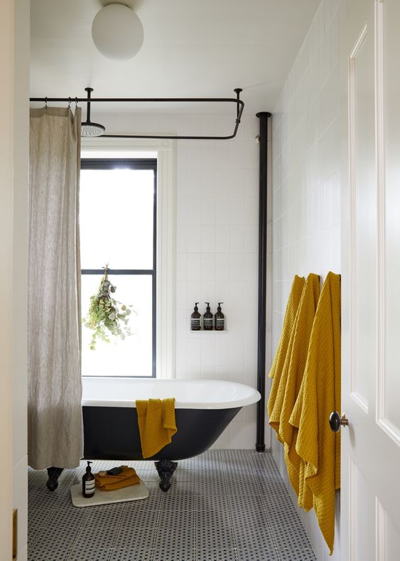 a set of mustard towels is a budget-friendly and easy way to bring a fall feel to your bathroom