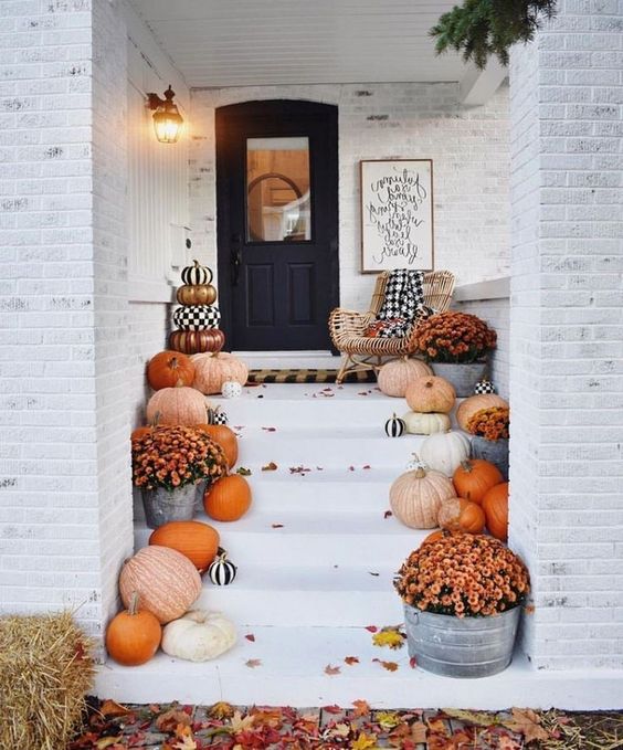 put natural pumpkins and fall blooms that you've grown on the steps indoors or outdoors