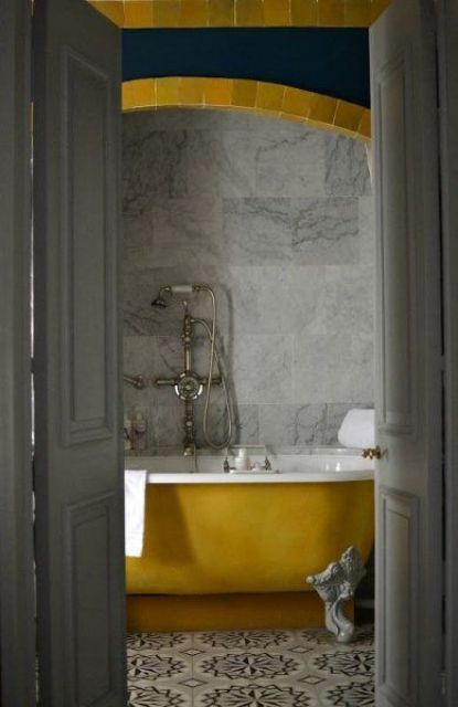 paint your clawfoot bathtub in a mustard shade to give the bathroom a fall feel and make it bolder and brighter