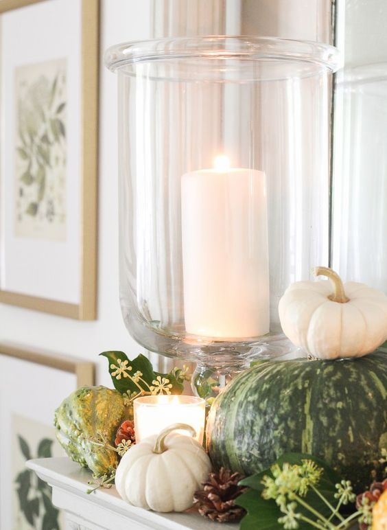 decorate your mantel with natural pumpkins, pinecones, greenery and gourds and add candles here and there