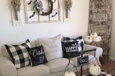13 simple coffee table styling with scales with white pumpkins and a sign plus a checked table runner for a farmhouse space