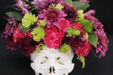 15 a skull with a bold flroal arrangement in pink, red and green plus some leaves is a timeless idea