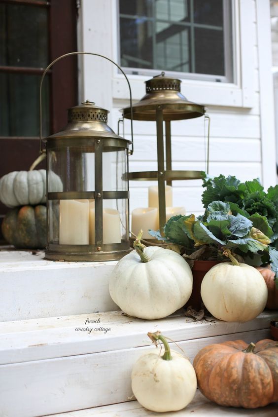 pumpkins, green leaves, candle lanterns are all you need for decorating your porch for the fall