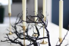 17 a black branch plus some tall candles in gold candleholders is a very elegant and chic option