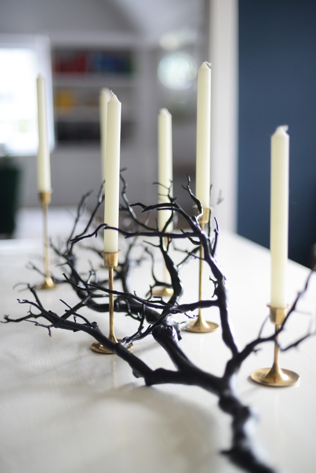 a black branch plus some tall candles in gold candleholders is a very elegant and chic option
