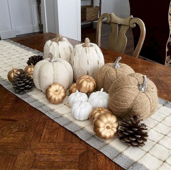 faux pumpkins of fabric, paper and plastic plus pinecones will give you a cool fall centerpiece
