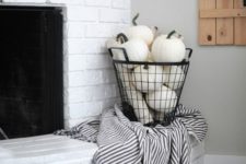 a wire basket filled with faux white pumpkins is a cool idea, which will last as long as you need