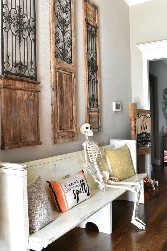 Put a skeleton on the bench and some Halloween inspired pillows, and you have a Halloween entryway