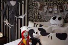 a black and white Halloween bedroom in Jack Skellington style, with dolls, a bunting, bedding and a Ghost dog