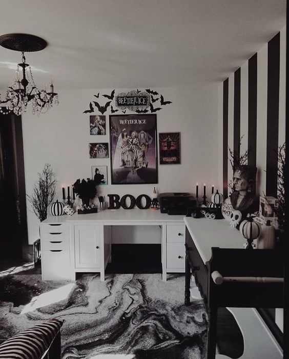 a black and white bedroom with scary busts, skulls, striped pumpkins, a watercolro rug and a Beetlejuice gallery wall