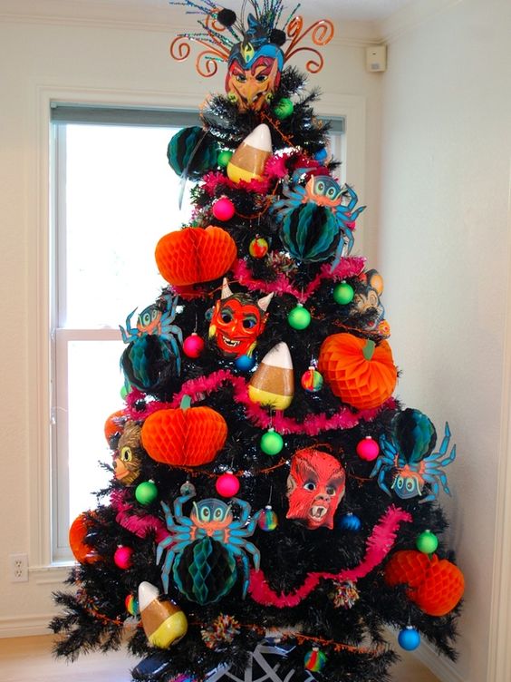 a bold and spooky Halloween tree with bright paper decorations, garlands and scary masks plus a creative topper